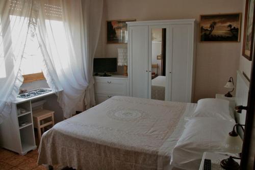 Katil atau katil-katil dalam bilik di B&B Domus Gratiae