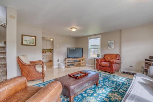 a living room with a couch and chairs and a tv at Alpine Coast Cottage - Meredith Lodging in Rockaway Beach