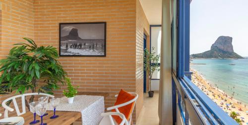 a dining room with a table and a view of the ocean at Nuevo Costa Blanca - Costa CarpeDiem in Calpe