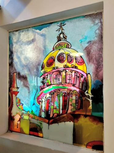 a painting of a building on a wall at Villa Sueño Azul B&B in Guanajuato