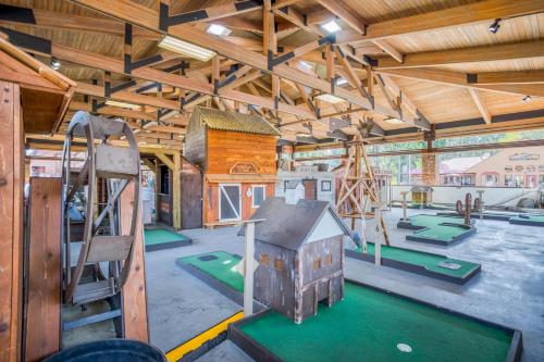 a play room with a playground with a slide at Quelah 21 - Meredith Lodging in Sunriver