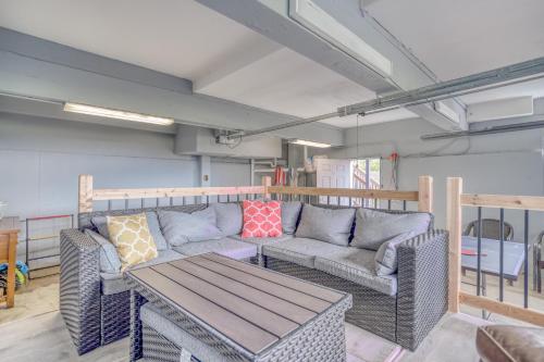 a living room with a couch and a table at Riverfront Gem - Meredith Lodging in Cloverdale