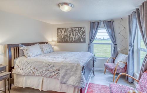 a bedroom with a bed and a window at Riverfront Gem - Meredith Lodging in Cloverdale