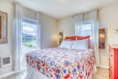 a bedroom with a bed and a large window at Riverfront Gem - Meredith Lodging in Cloverdale