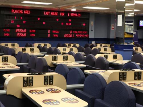 an empty trading hall with tables and chairs at Best Western Palace Hotel & Casino in Douglas