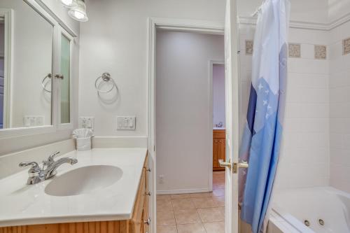 a white bathroom with a sink and a shower at Beverly Beach Seaclusion in Newport