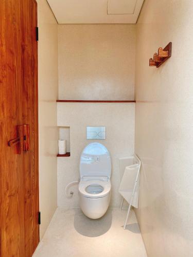 a small bathroom with a toilet and a sink at 22Land Hotel & Residence in Hanoi