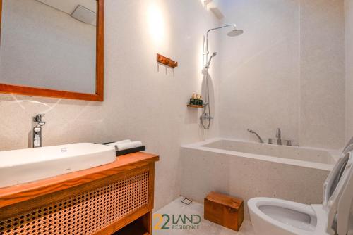 a bathroom with a sink and a toilet at 22Land Hotel & Residence in Hanoi