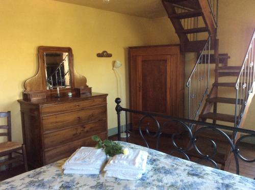 two towels sitting on a table in a room with a staircase at La Villa degli Ulivi in Fermo