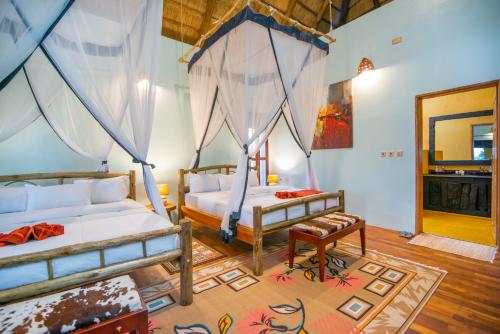 Voodi või voodid majutusasutuse Buffalo Safari Lodge toas