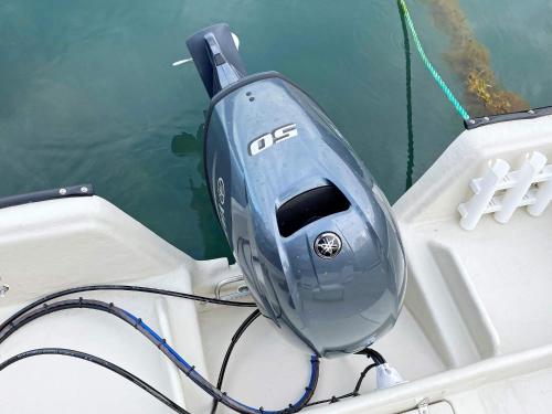 a blue appliance sitting on the side of a boat at 9 person holiday home in Reksteren in Haukafer