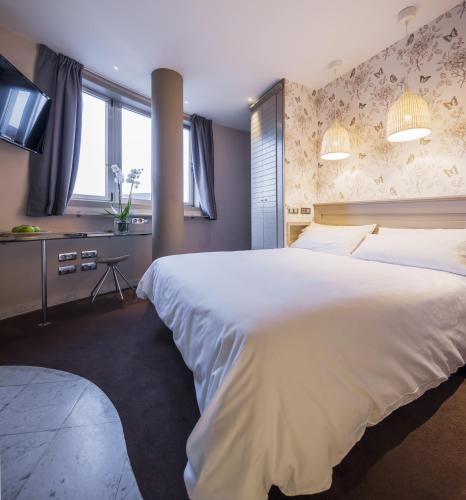 Ένα ή περισσότερα κρεβάτια σε δωμάτιο στο Hotel Nature Oviedo
