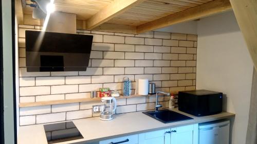 A kitchen or kitchenette at Waterfront Residence