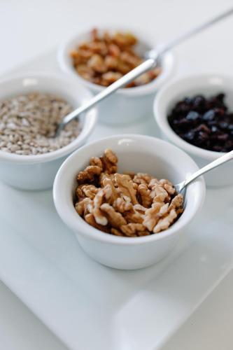 a group of bowls of nuts and seeds on a table at Hotel Erika in Alexandroupoli