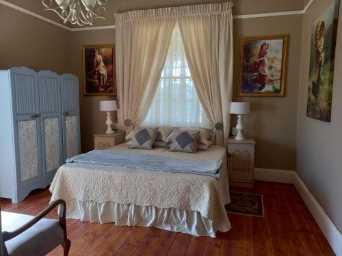 Posteľ alebo postele v izbe v ubytovaní Romantika Guesthouse