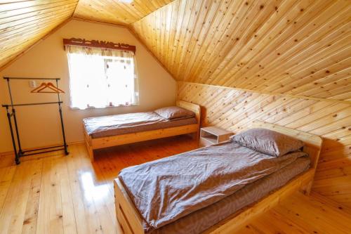 Postel nebo postele na pokoji v ubytování Садиба під Лісом