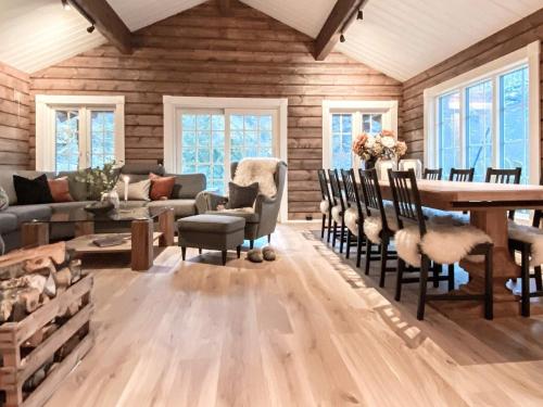 a living room with a table and chairs at 9 person holiday home in Geiranger-By Traum in Geiranger