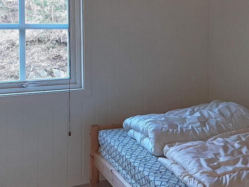 Postel nebo postele na pokoji v ubytování 8 person holiday home in lyngdal-By Traum