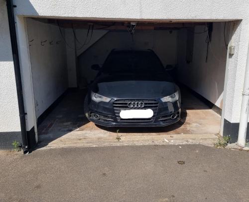 a audi car is parked in a garage at Neet Retreat - sleeps 7 next to beach in Bude