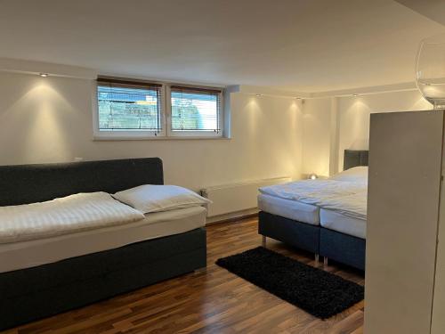 En eller flere senge i et værelse på Detmold - Hiddesen - Premium - Appartement