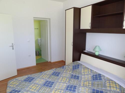 Posteľ alebo postele v izbe v ubytovaní Apartments Mišon