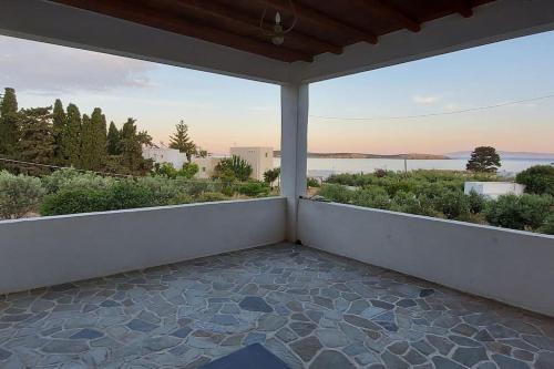 a balcony with a view of the water at Villa Stevi in Drios