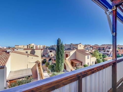 a view of a city from a balcony at Rev'Hotel in Port Leucate