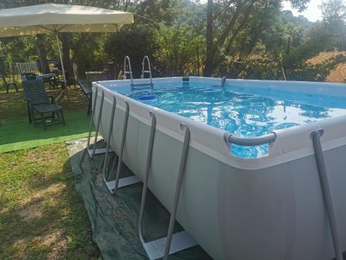 a large pool with aicrobialicrobialicrobialicrobial at Villa Olga - Lunigiana in Filattiera