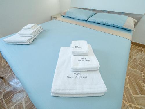 Posteľ alebo postele v izbe v ubytovaní Torre del Salento