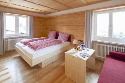 Postel nebo postele na pokoji v ubytování Alpe Oberstdorf