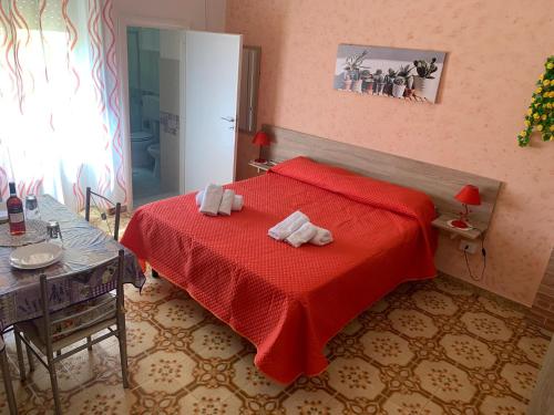Postel nebo postele na pokoji v ubytování La Scalinata 2
