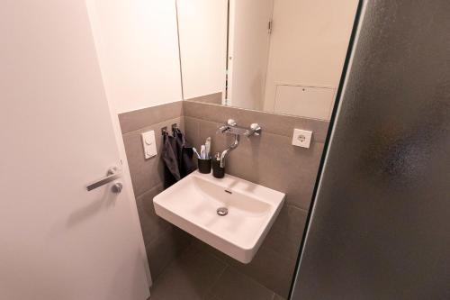 a bathroom with a sink and a mirror at Apartment in historischer Villa mit Parkplatz in Grünau im Almtal