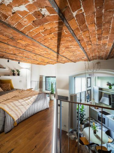 Una cama o camas en una habitación de Bellevue Navigli