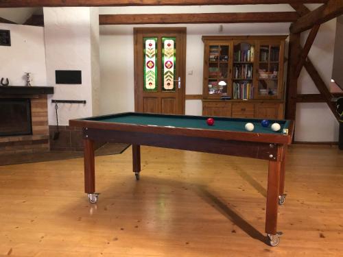 a pool table with balls on it in a room at Mamut in Rozvadov
