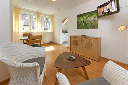 a living room with chairs and a table at Thermen Appartements Gabriela, 38 qm in Bad Krozingen