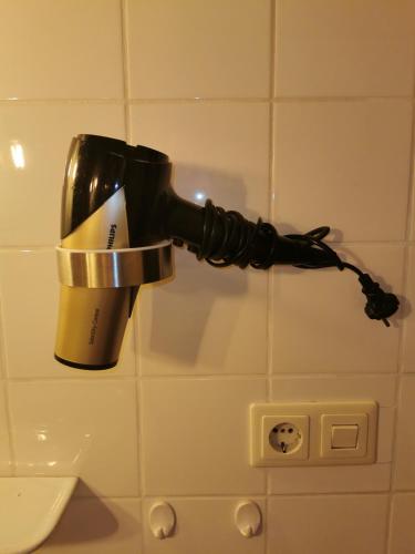 a coffee maker on a cup in a bathroom at Terrassenwohnung mit toller Aussicht & zentrumsnah in Hornberg