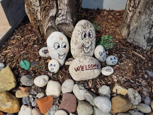 a group of rocks with faces painted on them at Studio Apartment Romeo in Velika Gorica