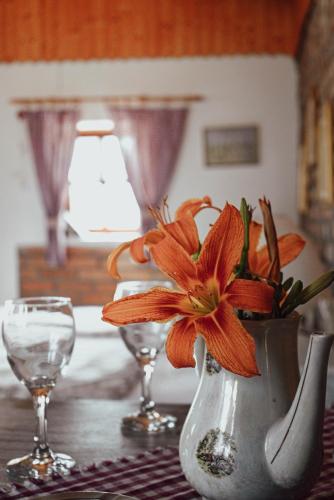a vase with a flower in it on a table at Studio Apartment Romeo in Velika Gorica