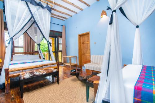 Voodi või voodid majutusasutuse Buffalo Safari Lodge toas