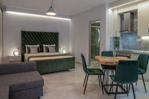 a bedroom with a bed and a table and chairs at Mansion House Parga in Parga
