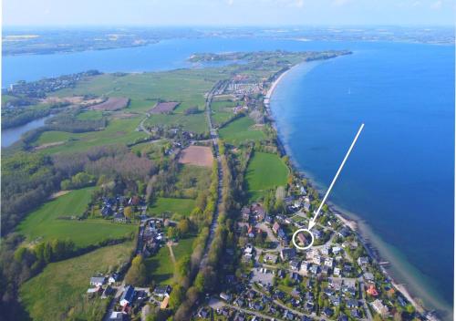an aerial view of an island in the water at Ferienhaus Seeblick - gemütliche 60qm - 50m zum Naturstrand - mit Terrasse und großem Garten in Glücksburg