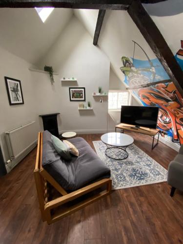 a living room with a couch and a table at The Fort York in York