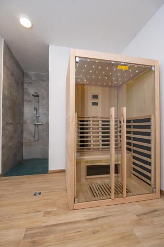 a bathroom with a shower in a room at Villa MVP in Bibinje