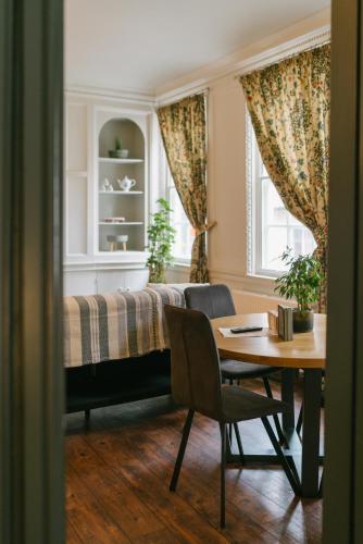 a bedroom with a bed and a table and a desk at The Fort York in York