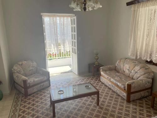 a living room with a couch and a coffee table at Traditional SeamansHouse Kochilos in Rogón