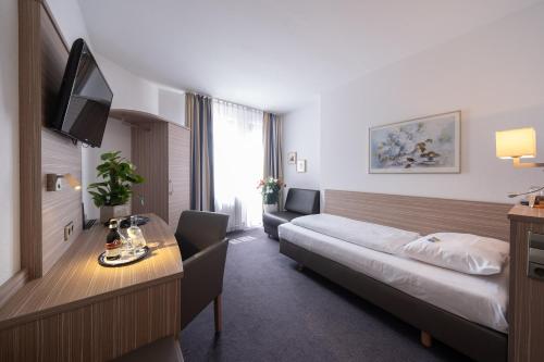 Postel nebo postele na pokoji v ubytování Hotel Bär