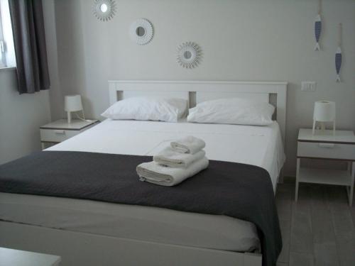 Krevet ili kreveti u jedinici u okviru objekta SoleeMare Barletta Apartments