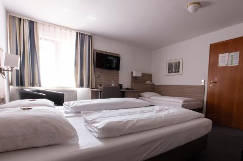 Postel nebo postele na pokoji v ubytování Hotel Bär
