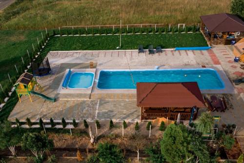 an overhead view of a swimming pool in a yard at Complex Stefanesti in Bozovici