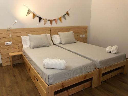 a bedroom with a large bed with a wooden headboard at Can Marlot in Navata